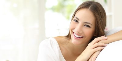 Beauty woman with white perfect smile looking at camera at home